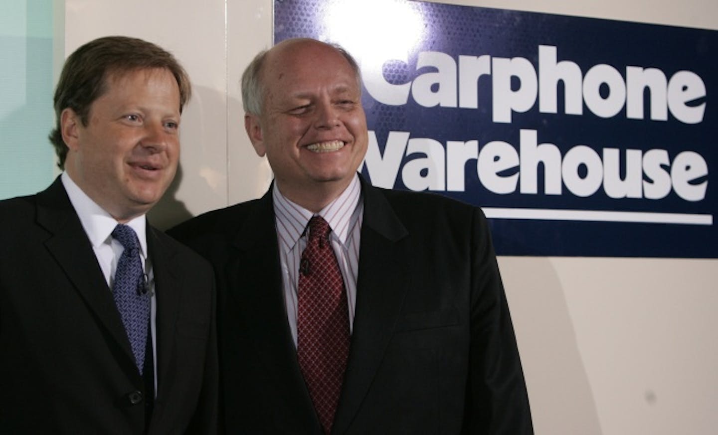 Charles Dunstone, CEO of Carphone Warehouse, left, and Brad Anderson, CEO of Best Buy, smiled in London Thursday after they announced a joint venture to tap into Europe's electronics market.