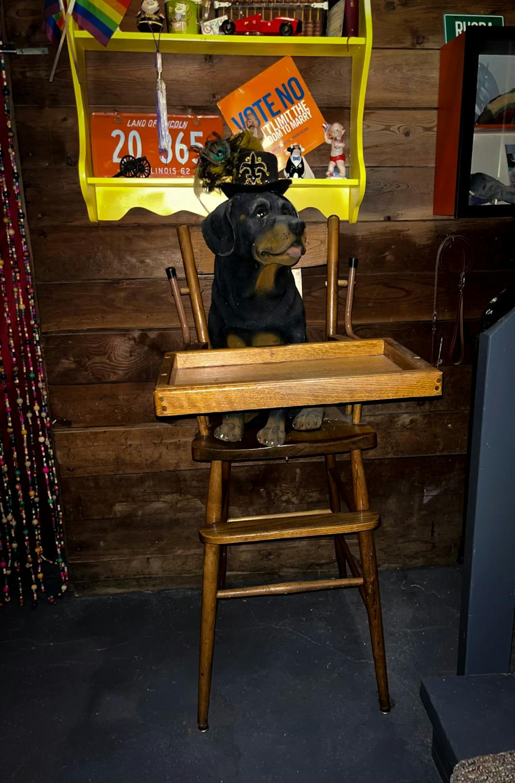 Tim Herbstrith finished the basement of his south Minneapolis home and created a 'speakeasy' decorated with repurposed family heirlooms. He turned his dad's old high chair into a host stand complete with a porcelain rottweiler that greets visitors.