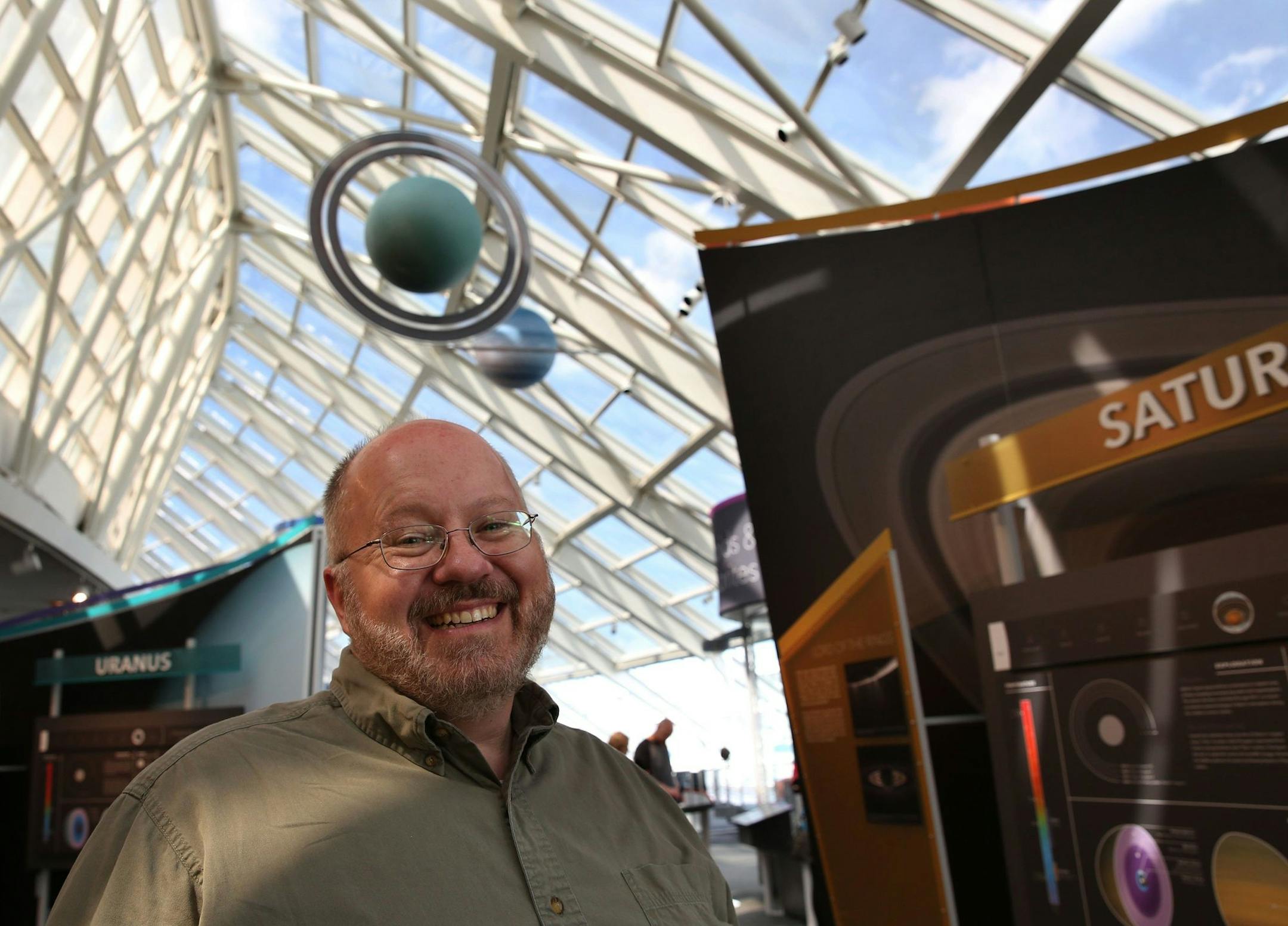 Mark Hammergren, astronomer at the Adler Planetarium in Chicago, is photographed September 12, 2013, and talks about the comet ISON that will be closest to the sun on Nov. 28 and might be highly visible before dawn on the days just following that. (Nancy Stone/Chicago Tribune/MCT)