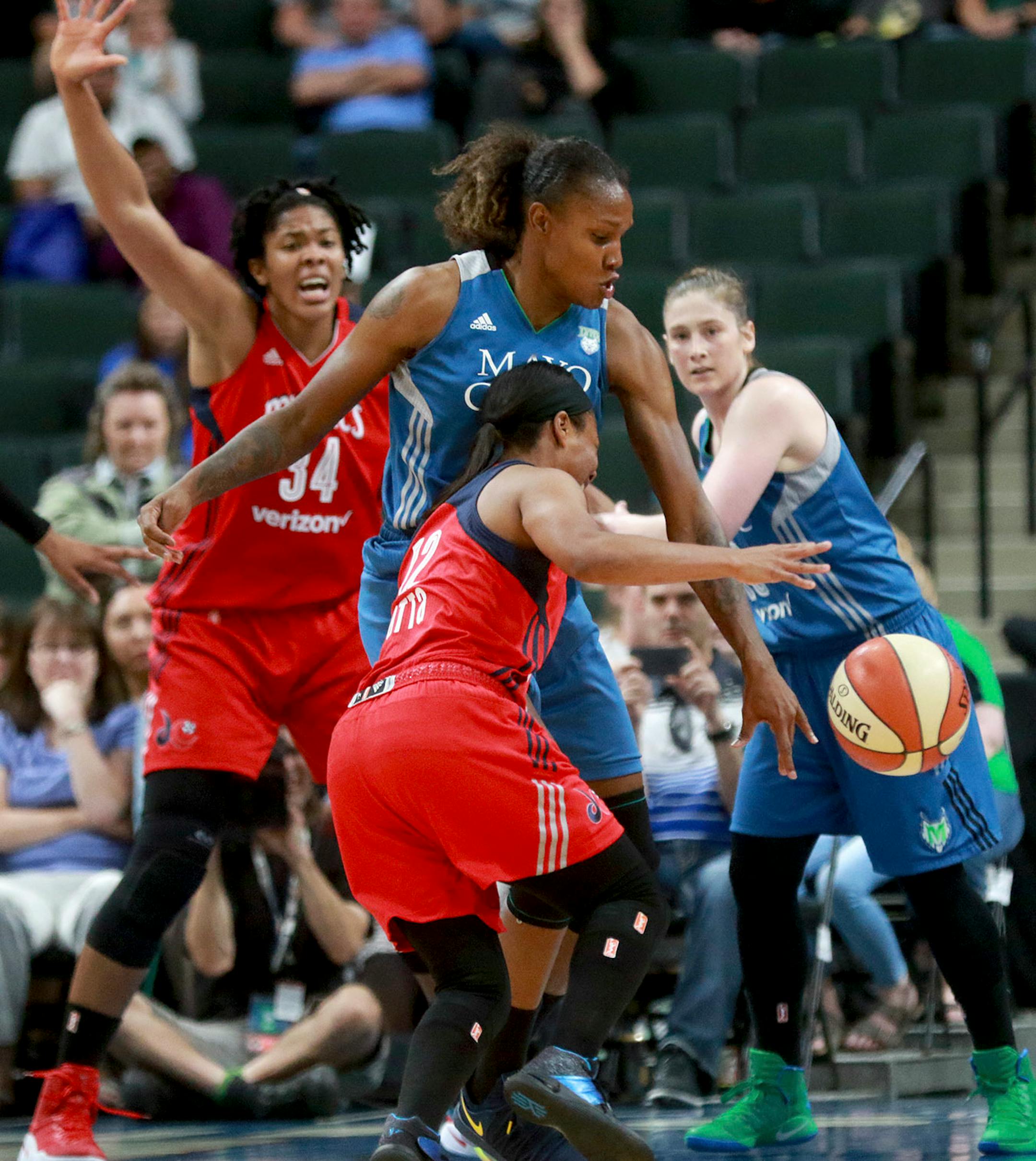 The Minnesota Lynx Rebekkah Brunson (32) is a road block to the basket for the Washington Mystic's Ivory Latta (12) during the second quarter Friday, June 22, 2017, at the Xcel Energy Center in St. Paul, MN.