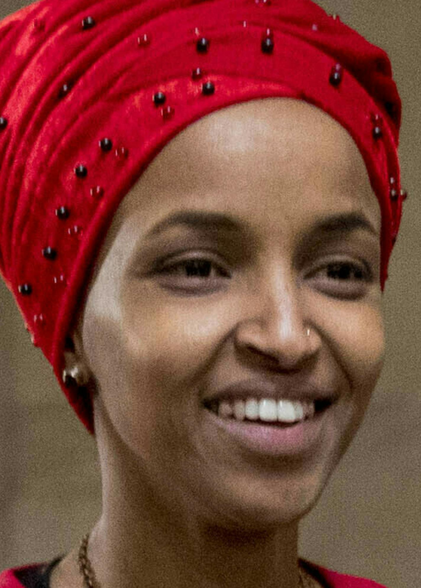 FILE - In this Jan. 16, 2019 file photo, Rep. Ilhan Omar, D-Minn., walks through the halls of the Capitol Building in Washington. In Omar's Minnesota district, both Jews and Muslims voiced concern about an inflammatory tweet on Israel that had the congresswoman apologizing within hours. While some Jews said she was being unfairly judged, some others said they feared she was being slow to learn from previous criticism. (AP Photo/Andrew Harnik, File)