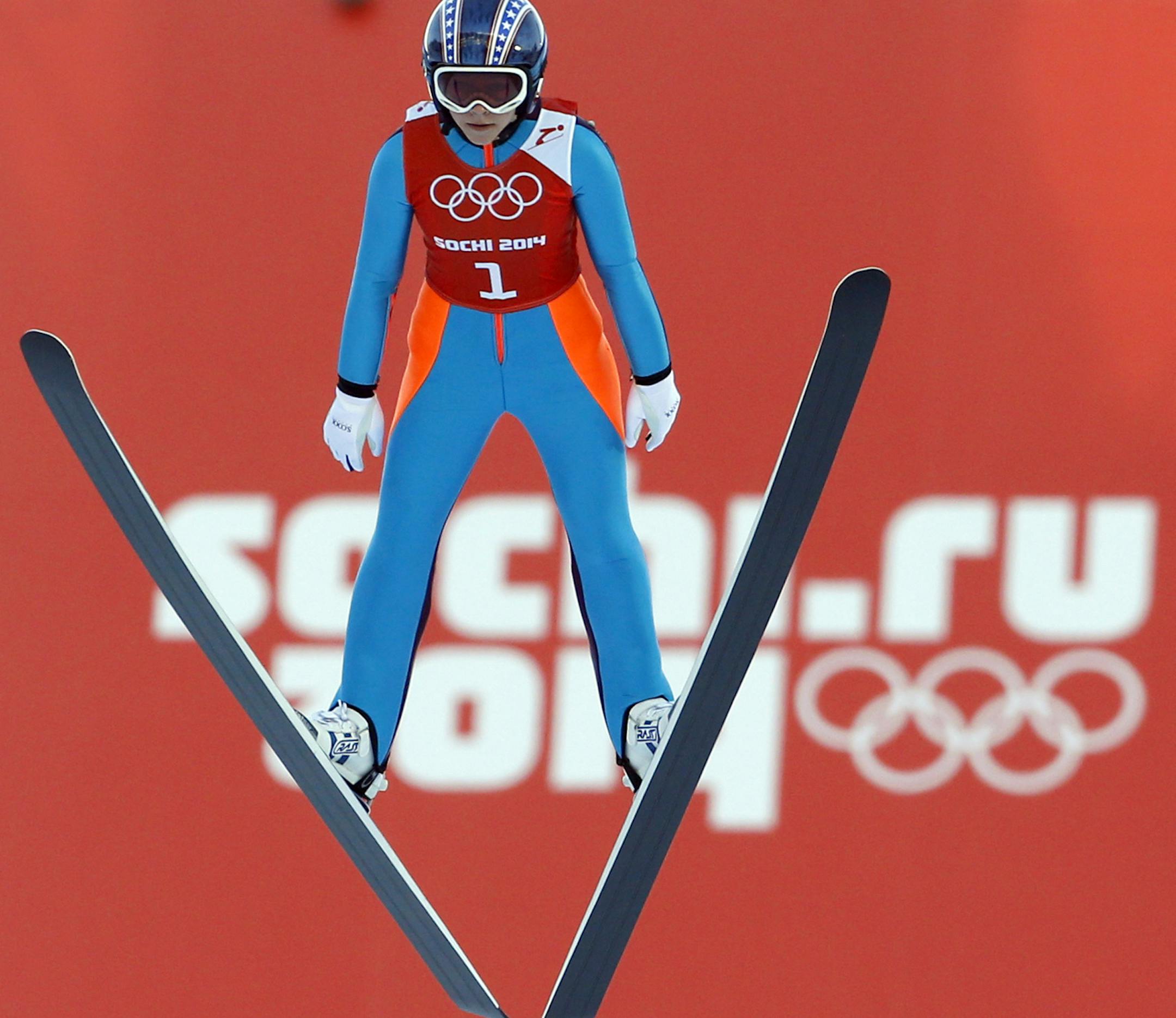 Sarah Hendrickson of the United States soars through the air during a women's ski jumping training session at the 2014 Winter Olympics, Saturday, Feb. 8, 2014, in Krasnaya Polyana, Russia. (AP Photo/Matthias Schrader)