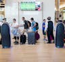 Travelers check bags at remote check-in terminals at Tampa International Airport in Tampa, Fla., Aug. 21, 2018. As carriers face higher fuel and labor
