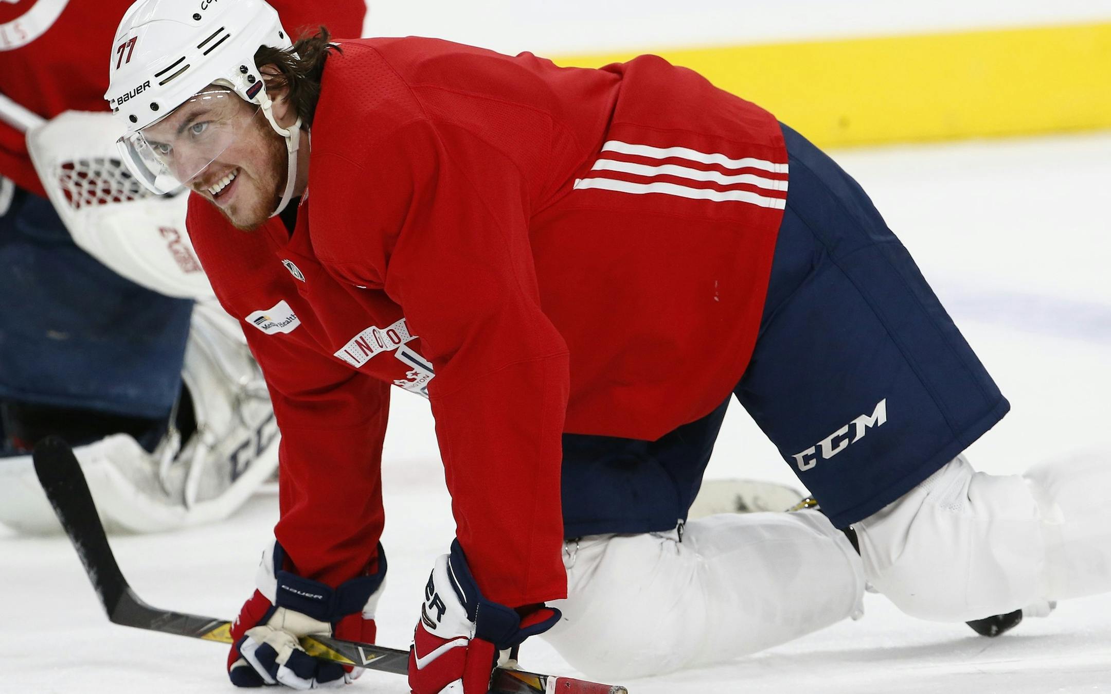 Washington Capitals right wing T.J. Oshie smiles as he stretches out with teammates during an NHL hockey practice Wednesday, June 6, 2018, in Las Vegas. The Capitals lead the Vegas Golden Knights 3-1 in the best-of-seven Stanley Cup Finals series. (AP Photo/Ross D. Franklin)