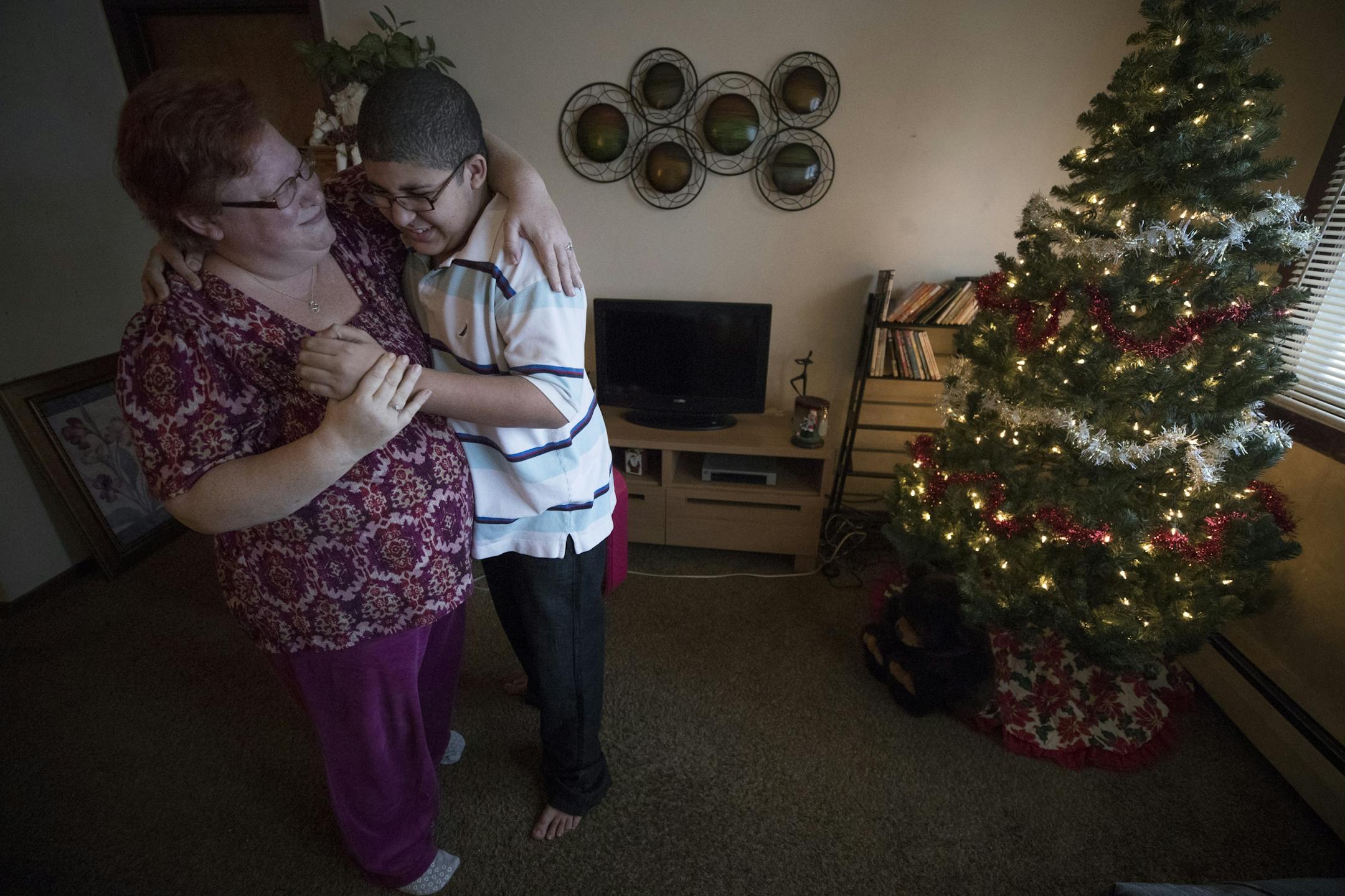 Cora Mustin played with her15-year-old son Jordan Mustin in their apartment after he arrived home from school Thursday December 14, 2017 in Mounds View, MN. Jordan has autism and a history of violent outbursts toward himself and family.