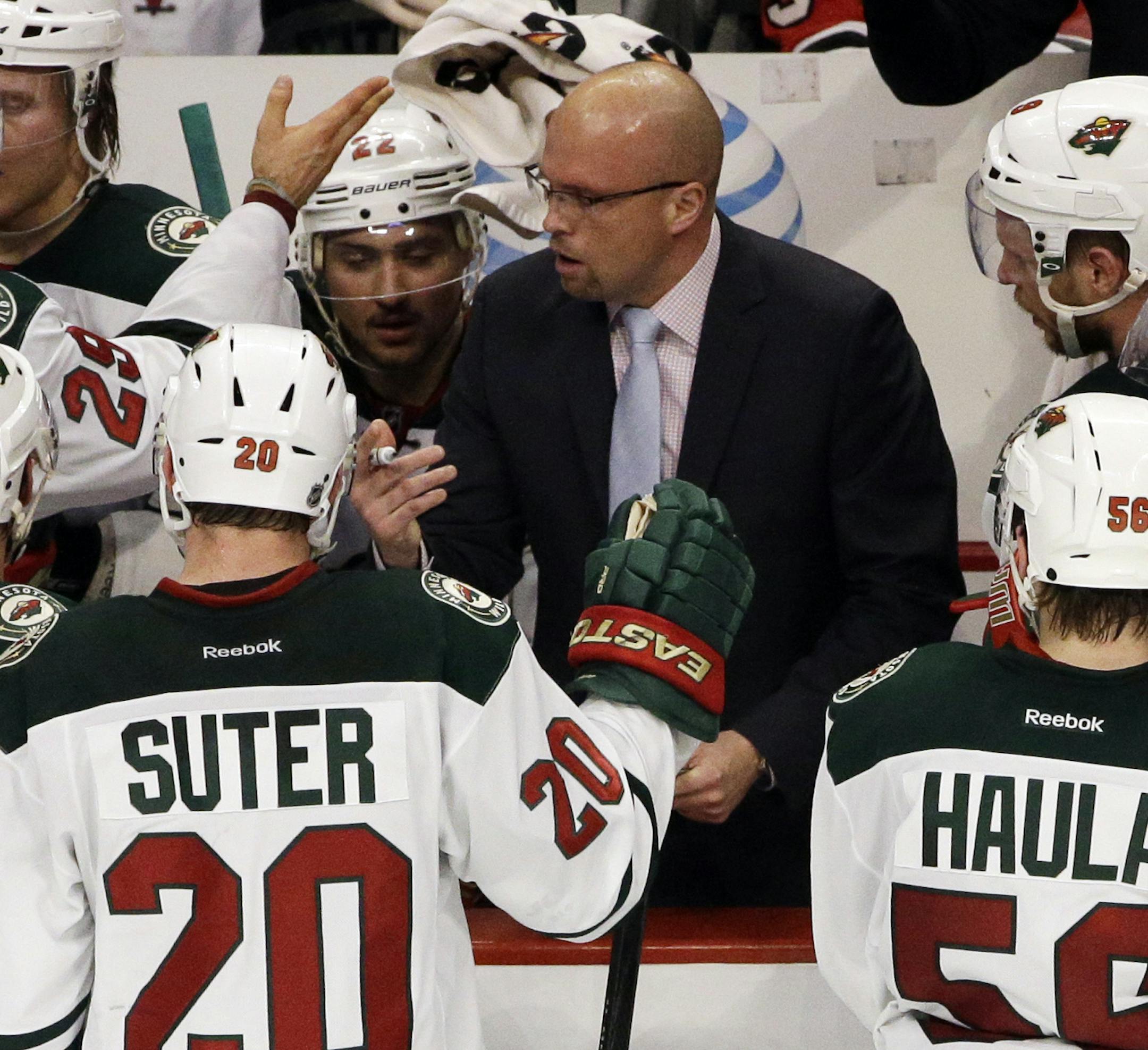 Minnesota Wild head coach Mike Yeo talks to his team during the third period in Game 5 of an NHL hockey second-round playoff series against the Chicago Blackhawks in Chicago,Sunday, May 11, 2014. The Blackhawks won 2-1. (AP Photo/Nam Y. Huh) ORG XMIT: MIN2014051515292253