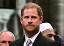 FILE - Britain's Prince Harry, Duke of Sussex looks on as Britain's King Charles III leaves Westminster Abbey after coronation in central London Satur