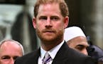 FILE - Britain's Prince Harry, Duke of Sussex looks on as Britain's King Charles III leaves Westminster Abbey after coronation in central London Satur
