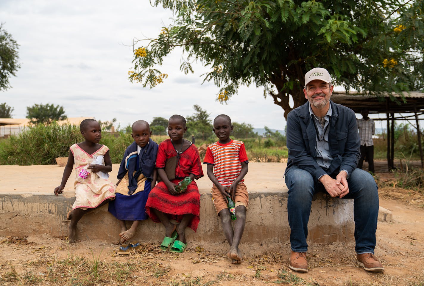 CEO Daniel Wordsworth of Minneapolis-based Alight (formerly American Refugee Committee) on World Refugee Day 2018 with children at the Nakivale Refugee Settlement in Uganda. Photo: Alight