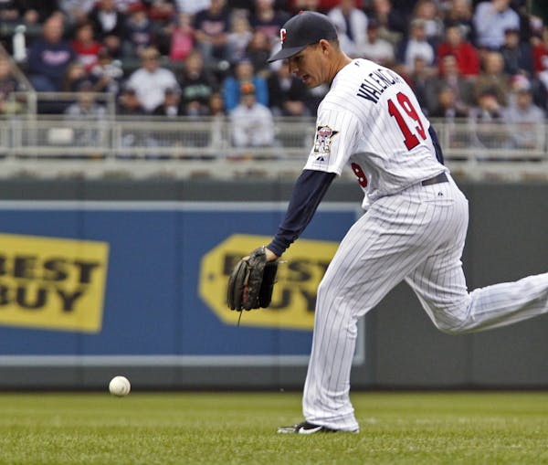 An Oakland hit slipped by Twins 3rd baseman Danny Valencia in first inning action.