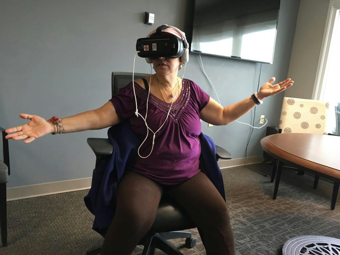 Ebenezer resident Sol Sepulveda, 64, said watching scenes of nature and people playing at the beach in the virtual-reality system left her feeling happier afterward. "I didn't have to buy a plane ticket, I was there," she said.