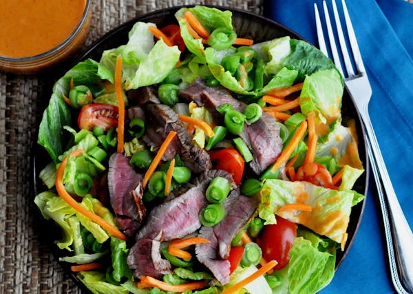 Credit: Meredith Deeds, Special to the Star Tribune Asian Steak Salad with Peanut Curry Dressing