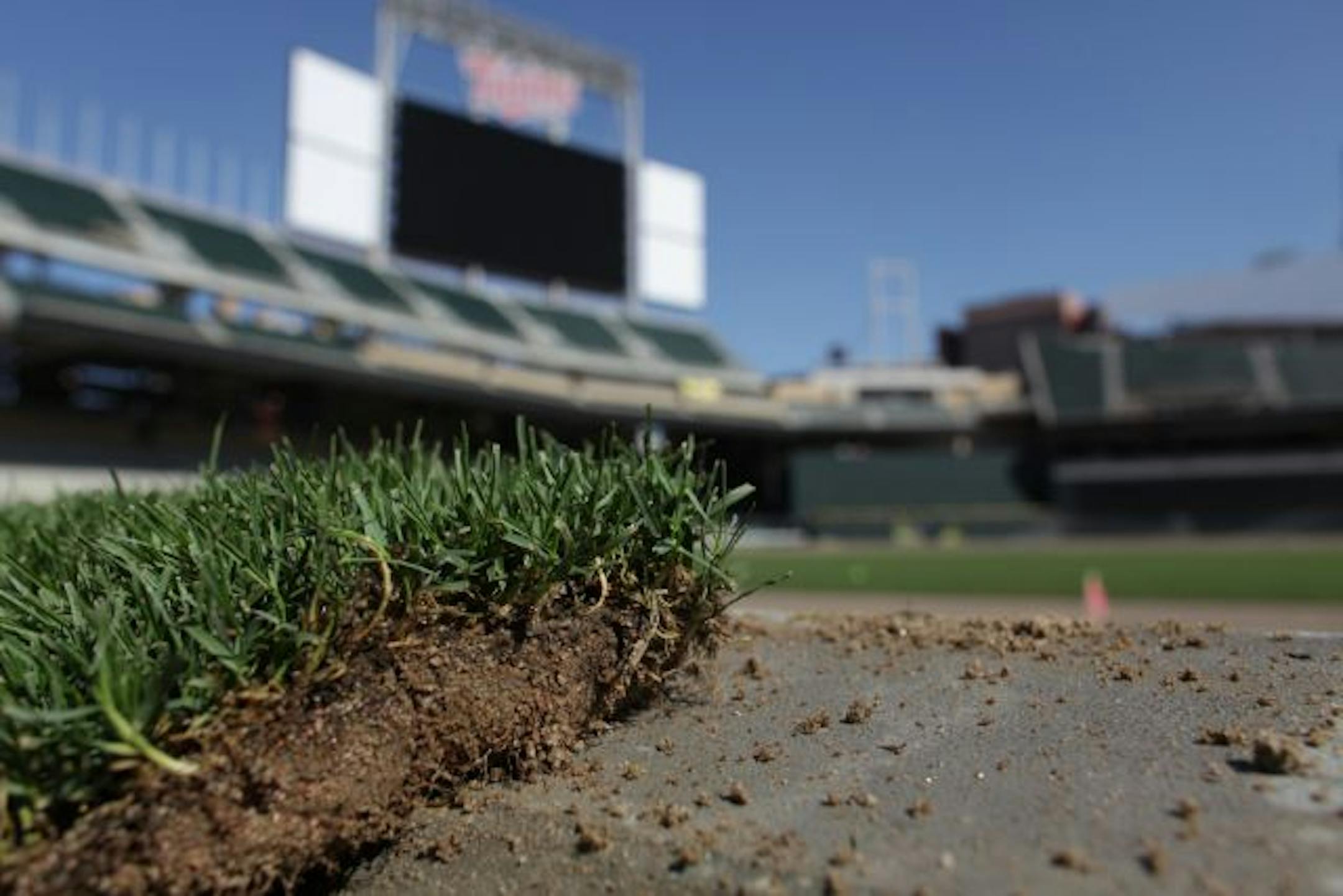 KYNDELL HARKNESS � kharkness@startribune.com 8/25/09SSOd being put in the Target Field[A broken piece of sod sat along the wall on the third base line at Target Field. The grass at the new park will be installed this week.