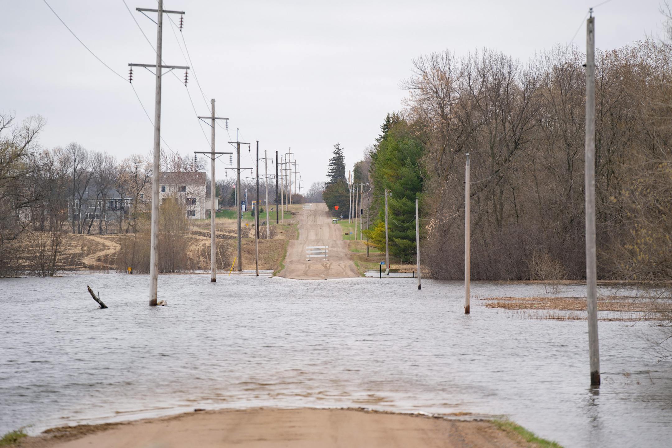 Floodwaters cover 90th St. SE just off County Road 17 on Wednesday, April 19, 2023, in Delano, Minn.