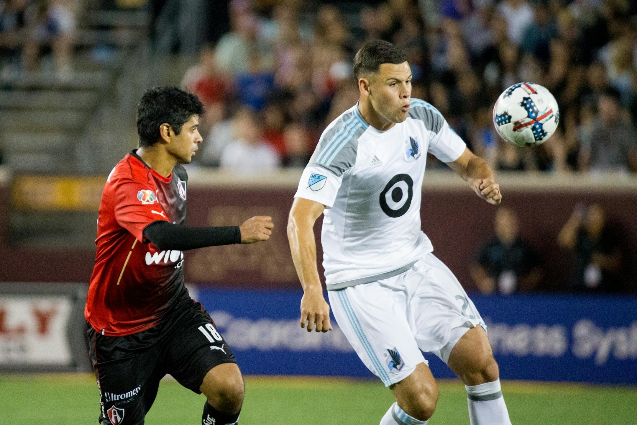 Minnesota United�s Christian Ramirez tracks the ball while Atlas� Luis Robles watches during the second half on Saturday, July 15, 2017, at TCF Bank Stadium.