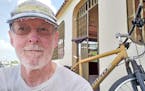 Father Dennis Dempsey, in front of his home while he was doing mission work in Venezuela.
