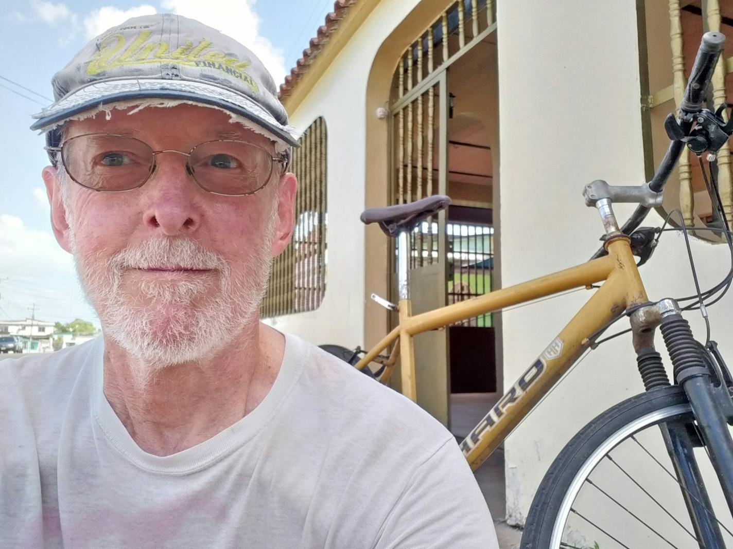 Father Dennis Dempsey, in front of his home while he was doing mission work in Venezuela.