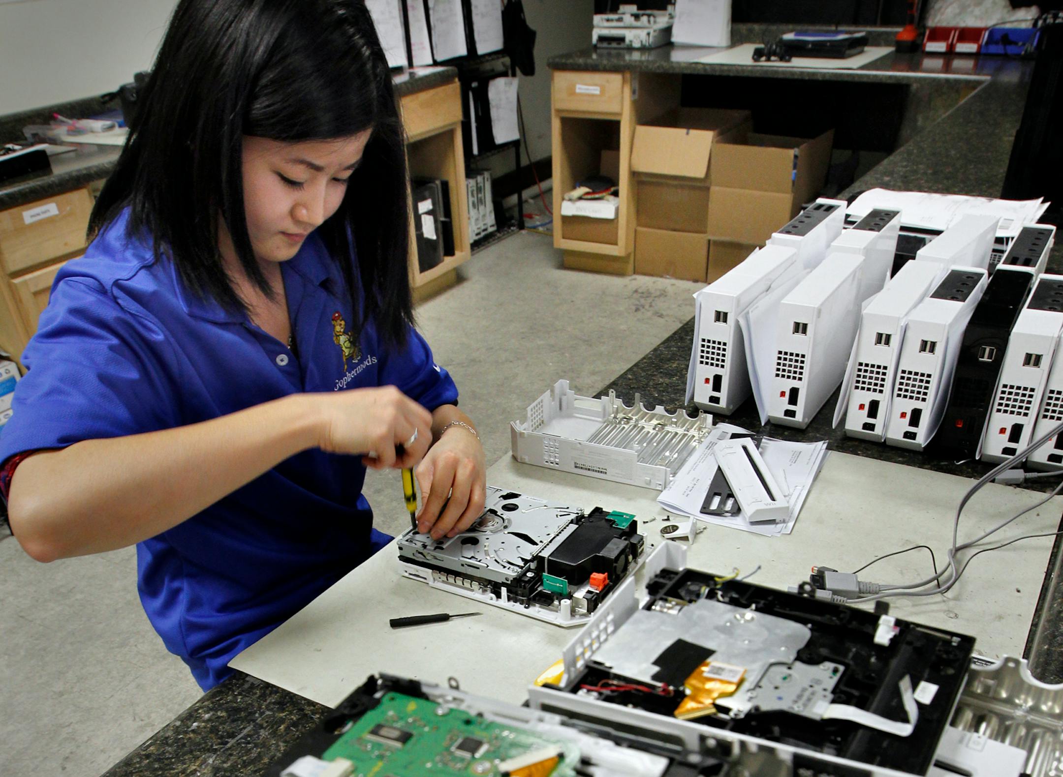 Gophermods technician Lucy Feng can repair four to five Wii units in and hour. The repair shop currently specializes in the Play Station and Wii units.