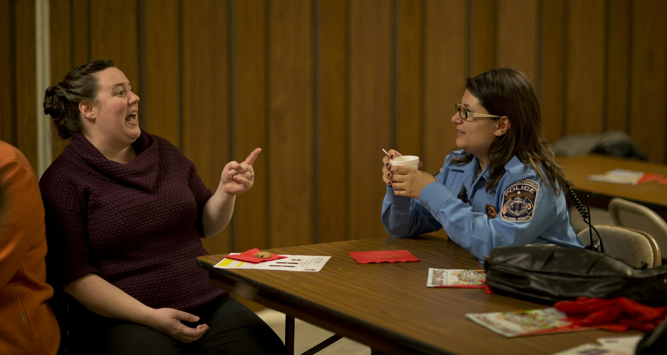 A year after winning a national community policing award, Columbia Heights PD rolls out another neighborhood outreach effort called Coffee with a Cop. The city on Minneapolis's north border has a very diverse population and lots of issues more synonymous with the big city than the suburbs. Adrianne Phillips and Columbia Heights Community Service Officer Jackie Duchschere at the third Coffee with a Cop, held Tuesday night, November 12, 2013 at the Columbia Heights Public Library. ] JEFF WHEELER &