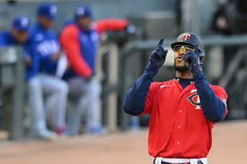 Minnesota Twins center fielder Byron Buxton (25) celebrated his 2-run home run in the bottom of the first inning against the Texas Rangers.