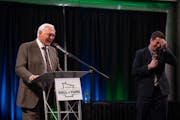 Former Gopher and North Star hockey legend Lou Nanne, left, told a story in response to a question by Star Tribune writer Mike Rand. Ten athletes were