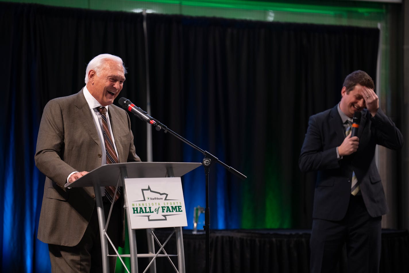 Former Gopher and North Star hockey legend Lou Nanne, left, told a story in response to a question by Star Tribune writer Mike Rand. Ten athletes were inducted into the Minnesota Sports Hall of Fame in a program Wednesday night, March 1, 2023 at the Huntington Bank Rotunda in the Mall of America in Bloomington, Minn. ] JEFF WHEELER • jeff.wheeler@startribune.com