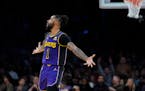 Former Wolves guard D'Angelo Russell celebrates after hitting a three-pointer Friday night for the Lakers. Russell finished with 44 points, and Los An