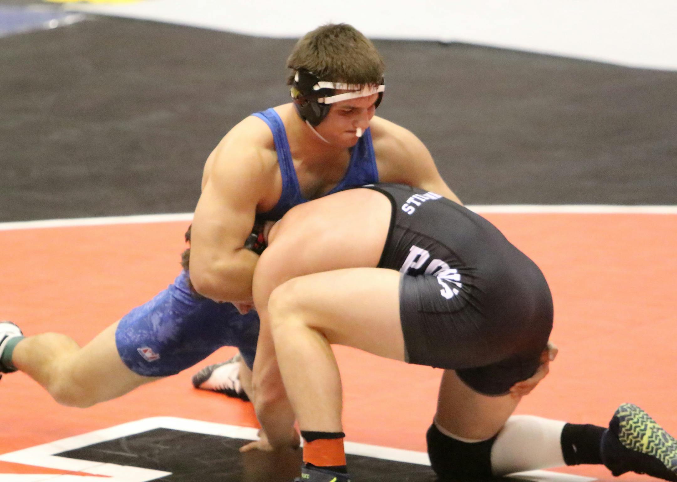 Mike Delich of Eastview, top, is closing in 100 career victories. He is ranked No. 2 at 190 pounds in Class 3A.