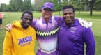 Fred Roufs (center) with Minnesota State Mankato wrestlers Paul Selman and Malcolm Allen at a fundraising golf tournament for the university a couple 