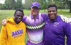 Fred Roufs (center) with Minnesota State Mankato wrestlers Paul Selman and Malcolm Allen at a fundraising golf tournament for the university a couple 