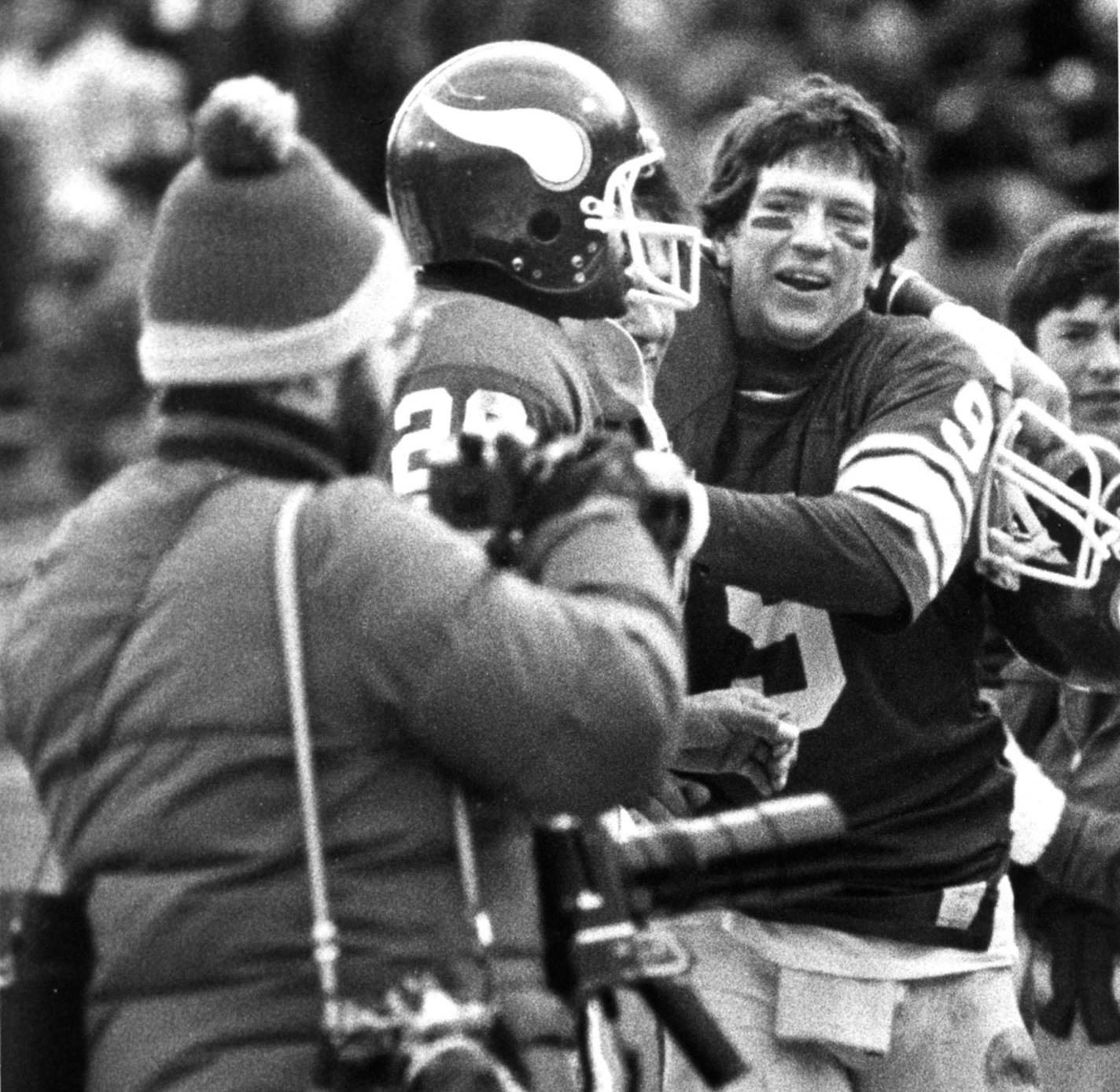 Credit: Star Tribune file photo, Duane Braley Caption: Vikings quarterback Tommy Kramer embraced wide receiver Ahmad Rashad after the two hooked up for the winning touchdown against Cleveland at Met Stadium in Bloomington on Dec. 14, 1980. ORG XMIT: MIN2014090917263659