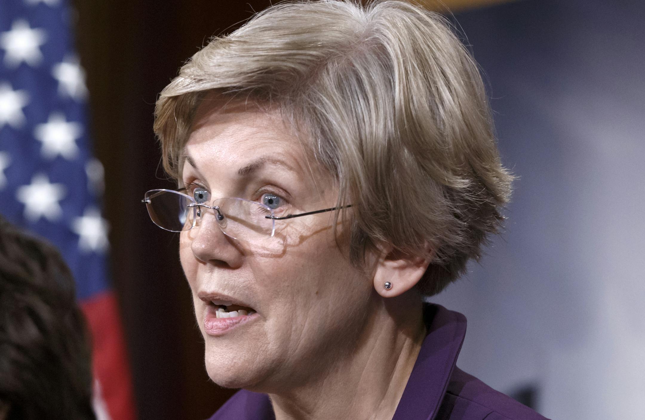 FILE - In this Dec. 10, 2014 file photo, Sen. Elizabeth Warren, D-Mass. speaks on Capitol Hill in Washington. More than 300 former campaign staffers and organizers for President Barack Obama have signed on to a letter urging Warren to run for president in 2016. It's the latest effort to nudge Warren into the race. The ex-Obama staffers say they want someone who will "stand up for working families and take on the Wall Street banks and special interests." (AP Photo/J. Scott Applewhite, File)
