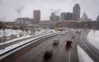 Morning traffic into downtown St. Paul during a snowstorm in St. Paul on Monday.