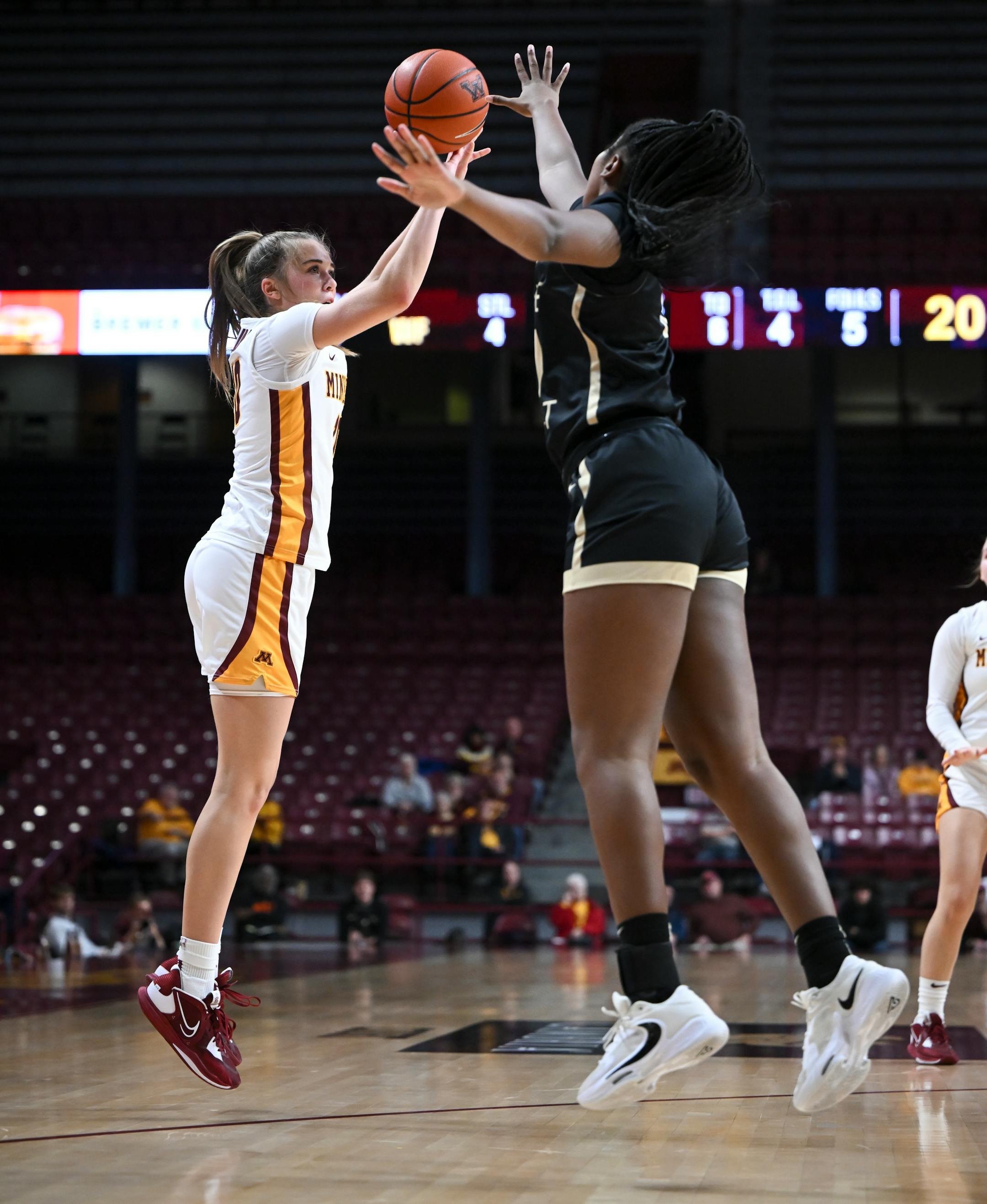 Minnesota Gophers guard Mara Braun (10) scores a 3-pointer as she's challenged by Wake Forest guard Raegyn Conley (11) during the first half.