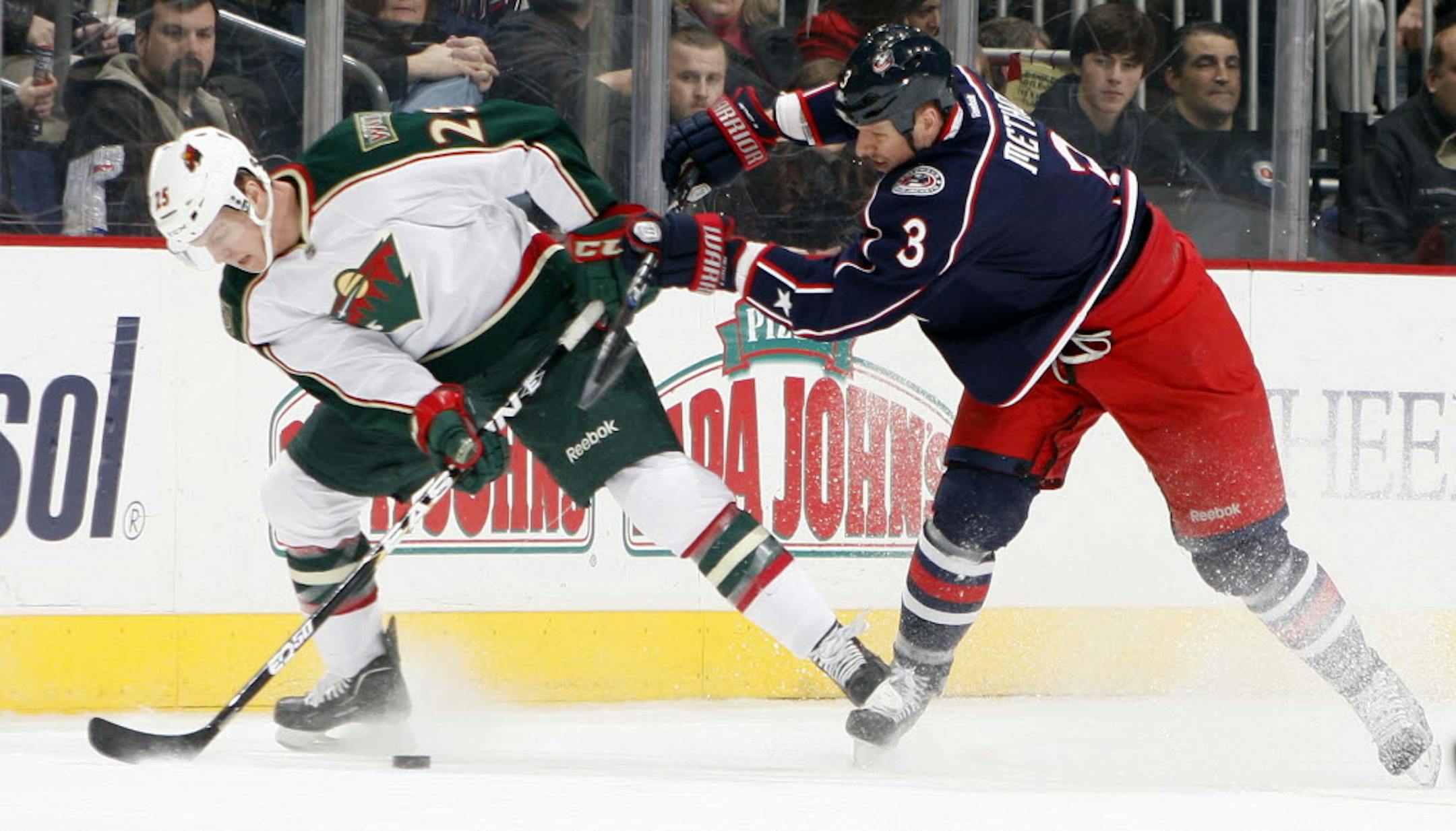 The Wild's Nick Johnson (left) was hit by Columbus' Marc Methot during Tuesday's 3-1 loss to the Blue Jackets.
