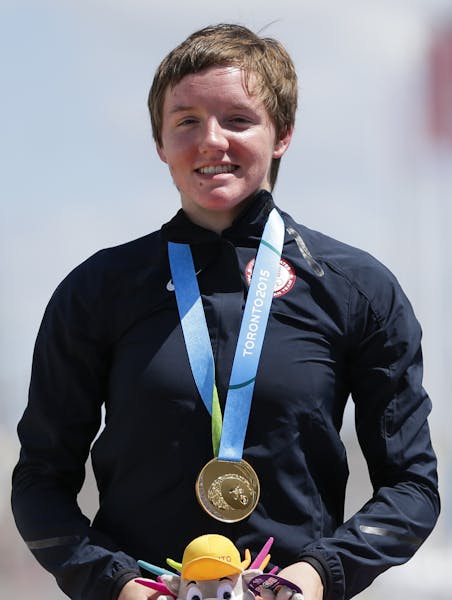 Gold medalist United States' Kelly Catlin wears her medal earned in the women's individual time trial cycling competition at the Pan Am Games in Milto
