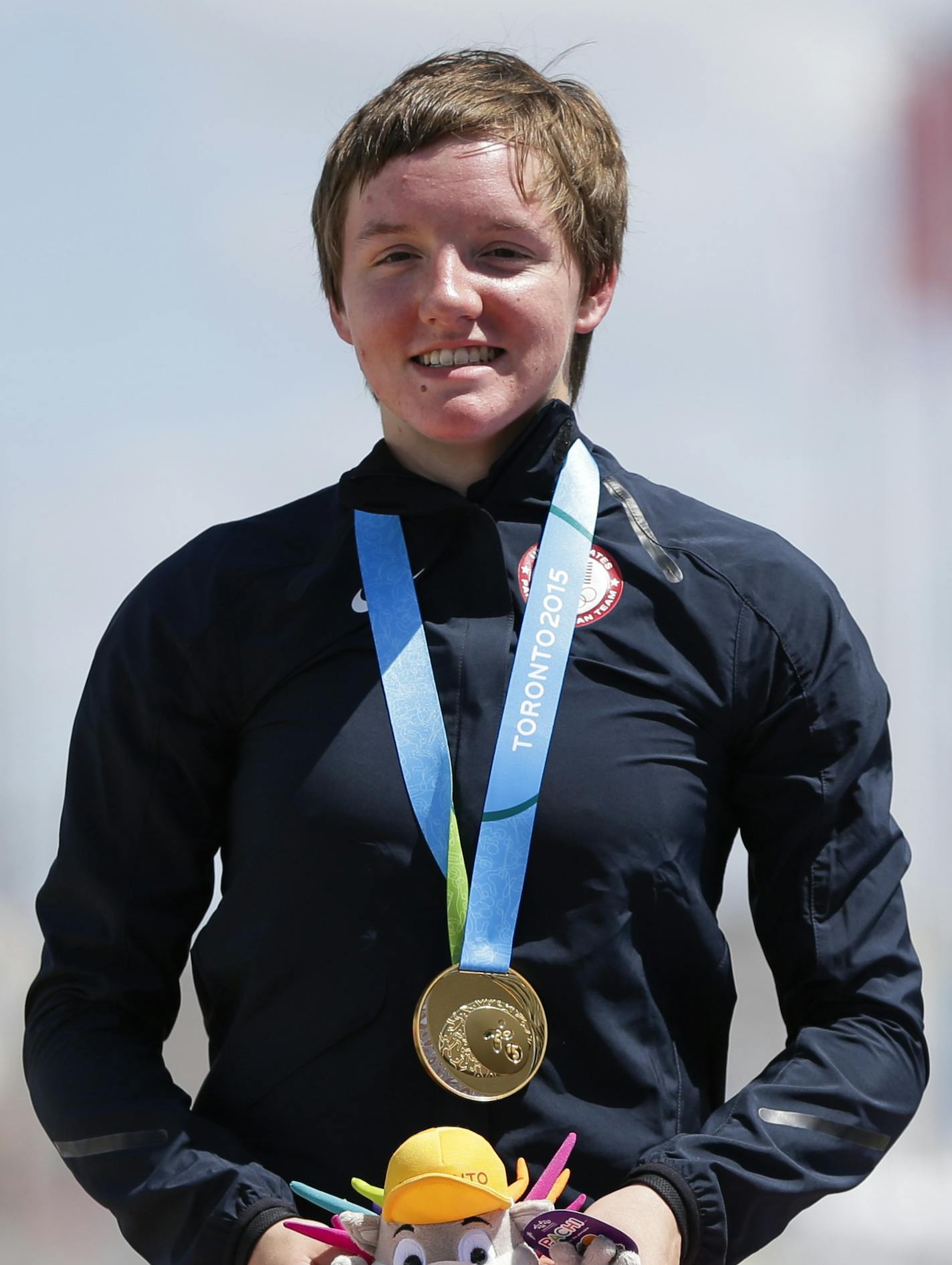 Gold medalist United States' Kelly Catlin wears her medal earned in the women's individual time trial cycling competition at the Pan Am Games in Milton, Ontario, Wednesday, July 22, 2015. (AP Photo/Felipe Dana) ORG XMIT: CAFD115