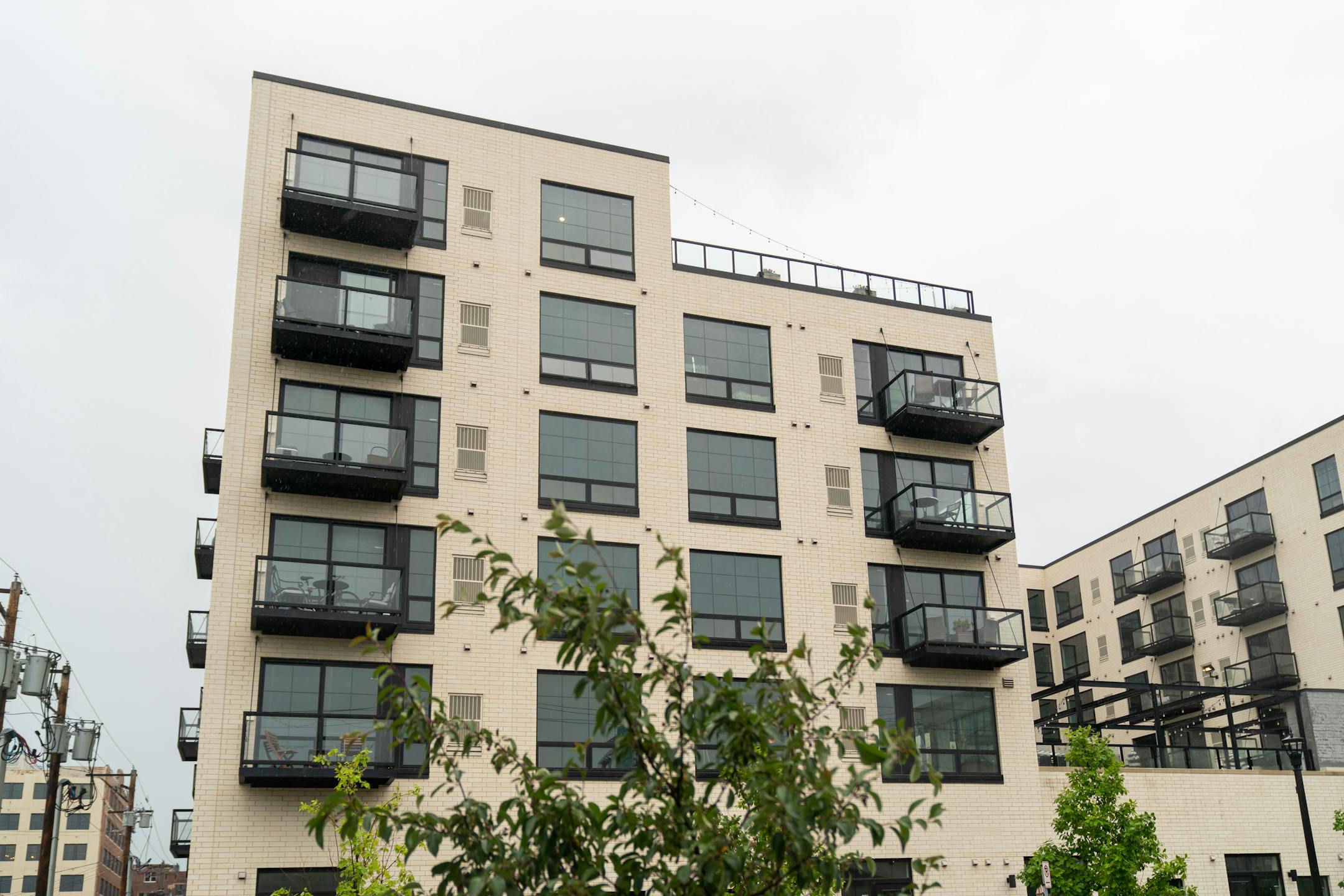 Variant has name on marble lobby desk and white-brick exterior was intended to make the building look very "different" from its neighbors.: https://www.variantmpls.com/ Address: 315 N 7th Ave, Minneapolis, MN 55401