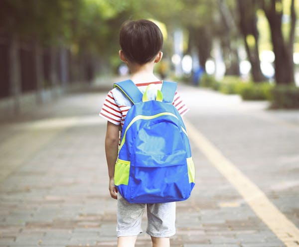 Little boy going to school with backpack ORG XMIT: MIN1607281416271210
