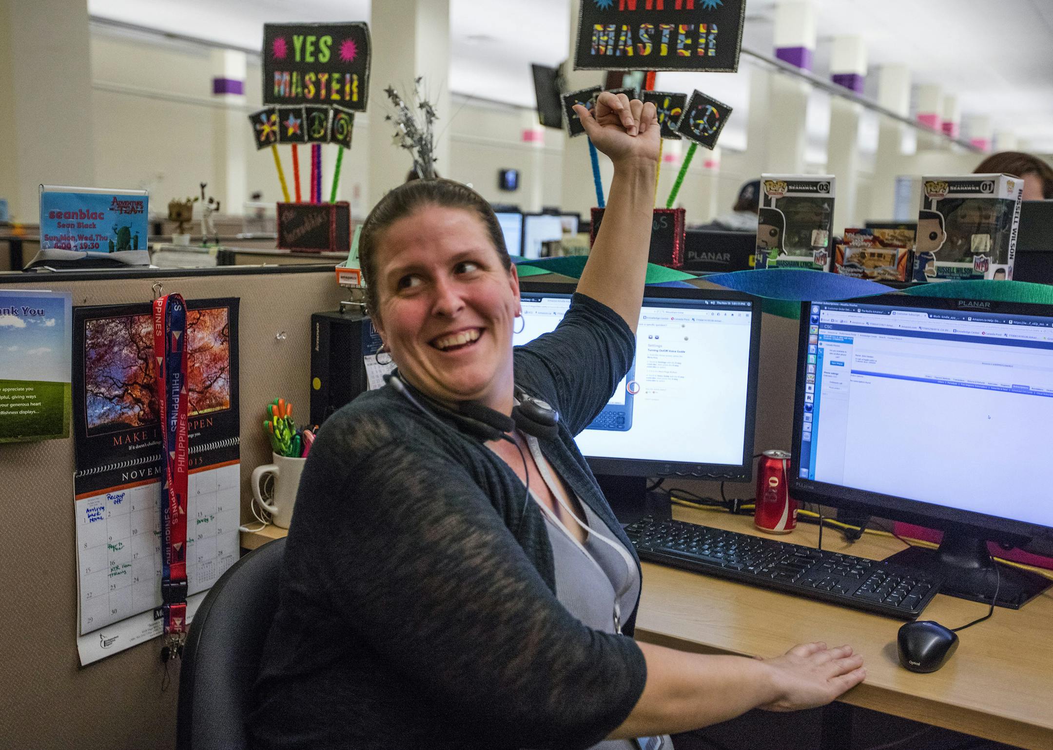 Customer-service associate Courtney Morris laughs as she's quizzed recently about her last conversation with a caller to Amazon's customer-service operation in Kennewick, Wash. (Steve Ringman/Seattle Times/TNS) ORG XMIT: 1177349