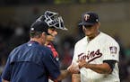 Minnesota Twins starting pitcher Adalberto Mejia (49) handed the ball to manager Paul Molitor in the top of the fourth inning before he was replaced o