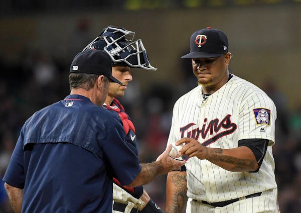 Minnesota Twins starting pitcher Adalberto Mejia (49) handed the ball to manager Paul Molitor in the top of the fourth inning before he was replaced o