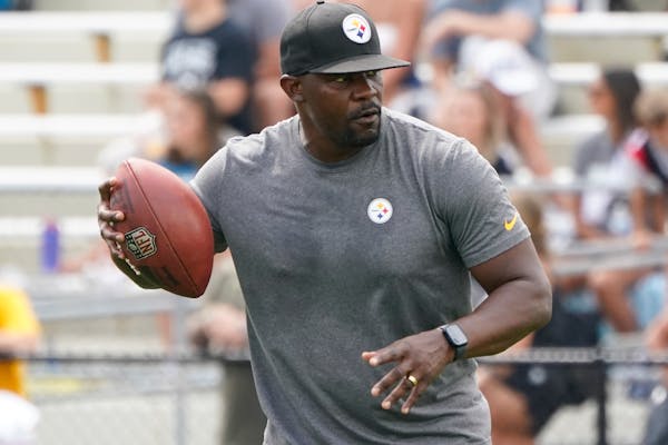 FILE - Pittsburgh Steelers senior defensive assistant Brian Flores works with the defense as they go through drills during practice at NFL football tr