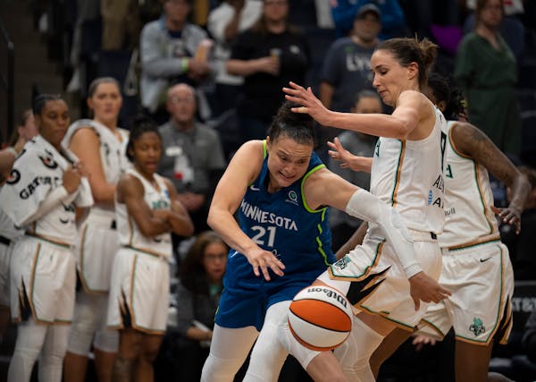 Minnesota Lynx guard Kayla McBride (21) was fouled by New York Liberty guard Rebecca Allen (9) in the fourth quarter.