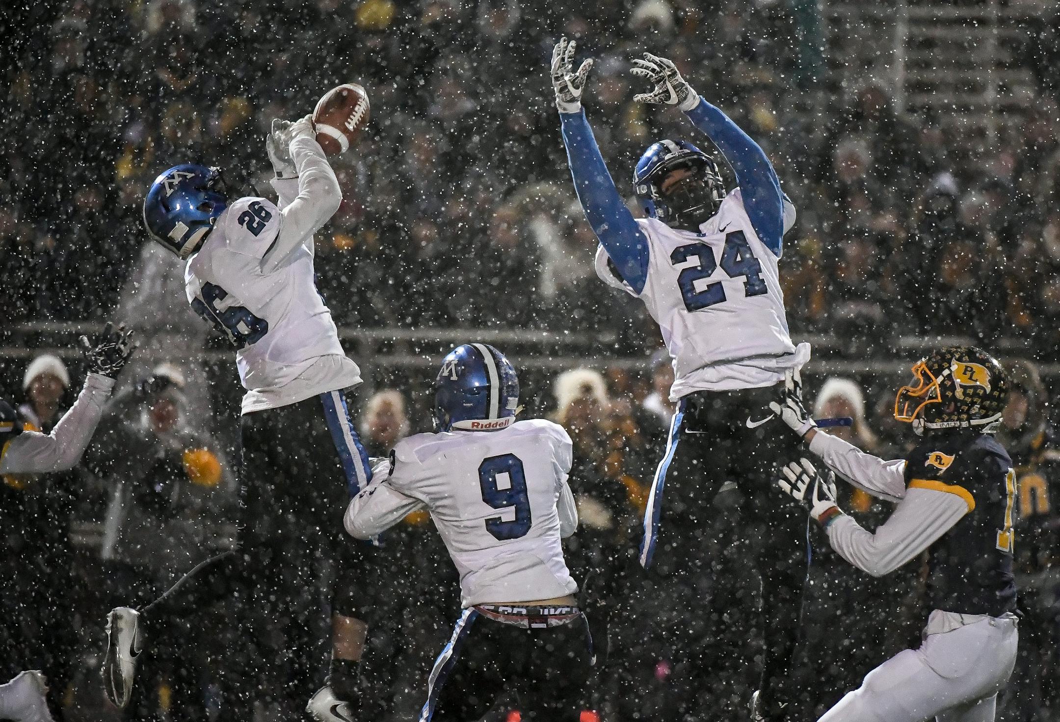 Weather is one of the concerns that can dampen interest in football's state tournament games played at neutral sites. Last year Minnetonka played Prior Lake in the snow during a Class 6A quarterfinal game at Osseo High School. Photo: Aaron Lavinksy, Star Tribune