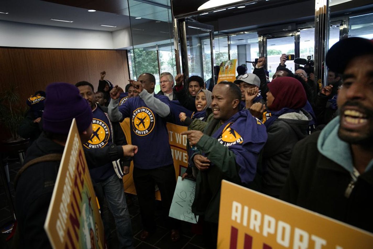 Several dozen protesters marched to Delta headquarters to protest the firing of seven Muslim workers who had been allegedly fired for praying while working for a Delta subcontractor.