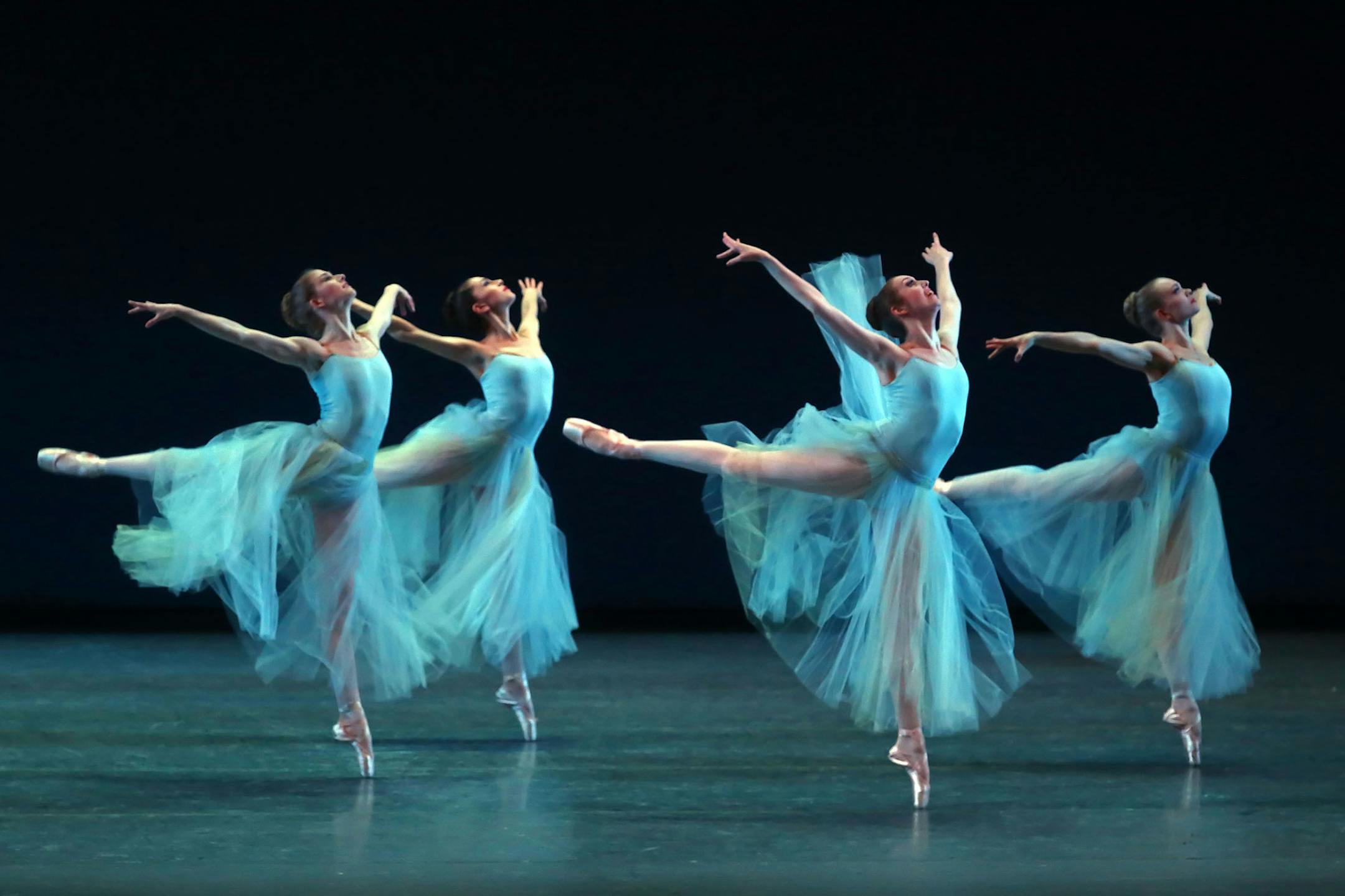 New York City Ballet dancers, from left: Megan Johnson, Jenelle Manzi, Gwyneth Muller and Lydia Wellington perform ‚ÄúSerenade‚Äù at the Lincoln Center in New York, Jan. 20, 2015. The program of George Balanchine classics opened the company‚Äôs six-week winter season. (Andrea Mohin/The New York Times) ORG XMIT: XNYT121