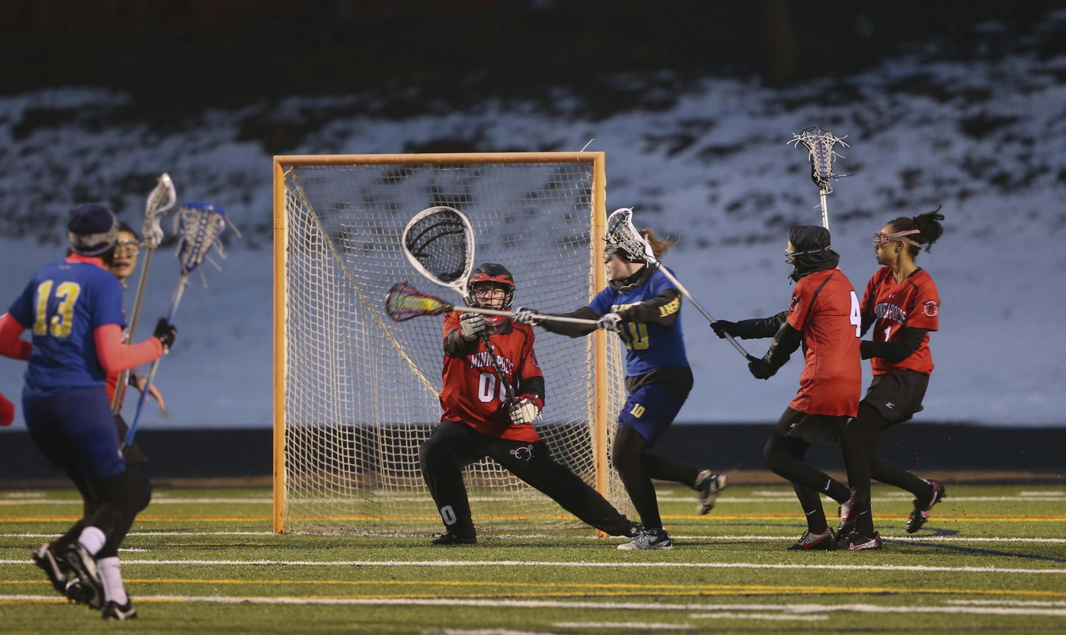 Minneapolis Lacrosse defeated Columbia Heights 19-6 on a cold and rainy Wednesday night, April 17, 2013 at Washburn High School Field in Minneapolis, Minn. Minneapolis Lacrosse Warriors' goalie Kayla Wuest got ready to stop a second half shot by Columbia Heights' Bridget Ebert Wednesday night.