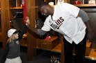 Minnesota Twins' Michael Pineda greets a young fan during the baseball team's TwinsFest on Friday, Jan. 19, 2018 in Minneapolis. (AP Photo/Hannah Fosl