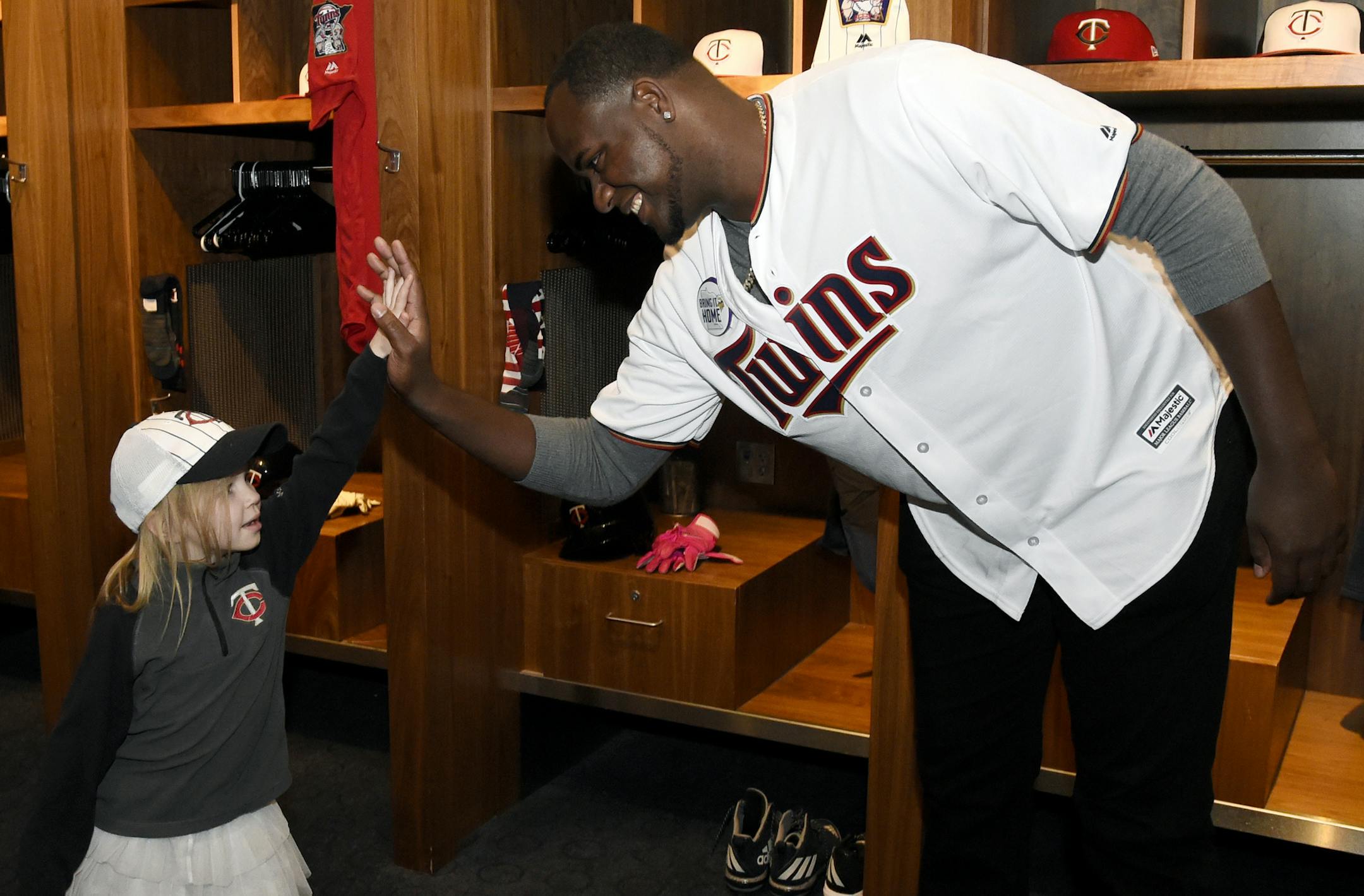 Minnesota Twins' Michael Pineda greets a young fan during the baseball team's TwinsFest on Friday, Jan. 19, 2018 in Minneapolis. (AP Photo/Hannah Foslien)
